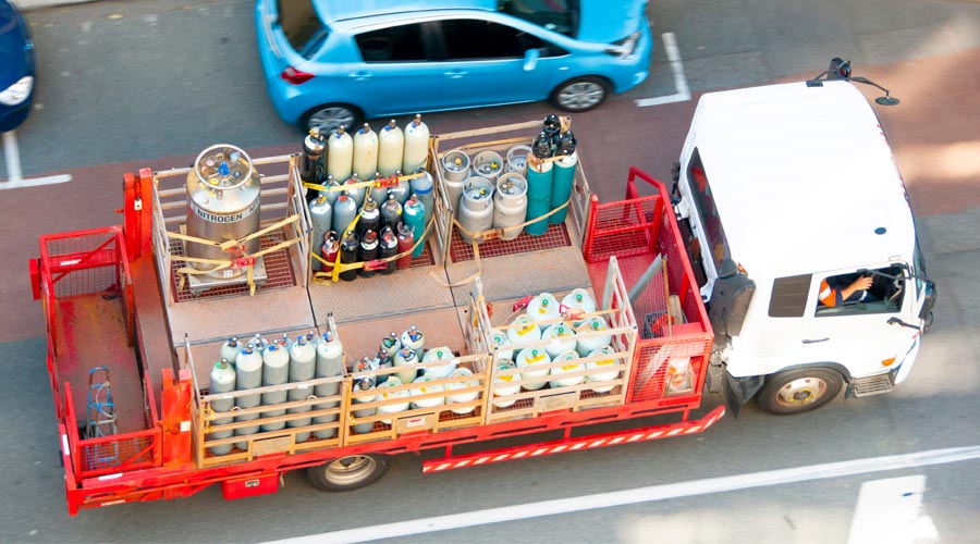 truck carrying various gas bottles