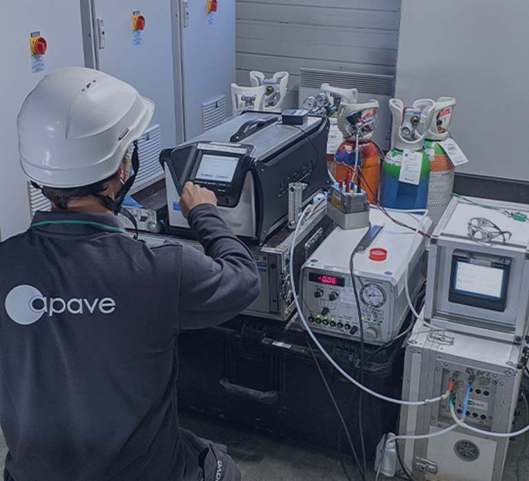 Apave employee carrying out tests and measurements on pressure vessels