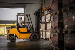 Apave employee in a forklift