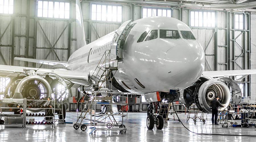 An aircraft being checked in a hangar